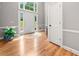 Bright foyer with hardwood flooring, tall windows, and an inviting entrance to the home at 3638 Sope Creek Farm Se, Marietta, GA 30067