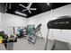 Basement gym offers a treadmill, free weights, inversion table and exercise equipment at 3638 Sope Creek Farm Se, Marietta, GA 30067