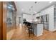 Contemporary kitchen featuring an island with bar stools, wine cellar, and stainless appliances at 3638 Sope Creek Farm Se, Marietta, GA 30067