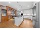 Modern kitchen featuring white cabinetry, stainless steel appliances, and a custom wine cellar at 3638 Sope Creek Farm Se, Marietta, GA 30067