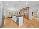 Bright, open kitchen with island, bar seating, and stainless steel appliances at 3638 Sope Creek Farm Se, Marietta, GA 30067