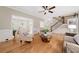 Elegant living room with hardwood floors, neutral decor, and a view of the staircase at 3638 Sope Creek Farm Se, Marietta, GA 30067