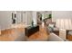 Open-concept living space with hardwood floors, multiple seating areas, and a seamless flow at 3638 Sope Creek Farm Se, Marietta, GA 30067