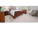 Comfortable main bedroom featuring a large bed, matching dressers, neutral walls, and bright windows at 3638 Sope Creek Farm Se, Marietta, GA 30067