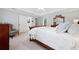 Cozy main bedroom with a plush bed, seating area, neutral colors, and ample natural light at 3638 Sope Creek Farm Se, Marietta, GA 30067