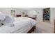 Light-filled main bedroom with a large bed, tray ceiling, and access to a walk-in closet at 3638 Sope Creek Farm Se, Marietta, GA 30067