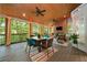 Spacious screened porch with wood-paneled ceiling, outdoor dining area, and cozy seating near a fireplace at 3638 Sope Creek Farm Se, Marietta, GA 30067