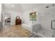 Bright bathroom features a large soaking tub and glass enclosed walk-in shower at 542 Fairway Dr, Woodstock, GA 30189