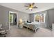 Bedroom with gray walls, a ceiling fan, natural light and carpeting at 542 Fairway Dr, Woodstock, GA 30189