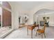 Inviting entryway with soaring windows, showcasing a glimpse of the home's elegant staircase and open layout at 542 Fairway Dr, Woodstock, GA 30189
