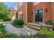 Charming home exterior highlighting the front door, walkway, and beautiful brickwork at 542 Fairway Dr, Woodstock, GA 30189