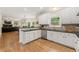 Spacious kitchen with granite countertops, stainless steel appliances, and an inviting breakfast bar at 542 Fairway Dr, Woodstock, GA 30189