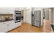 Well-equipped kitchen featuring stainless steel appliances and a convenient layout for easy meal preparation at 542 Fairway Dr, Woodstock, GA 30189