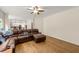 Spacious living room with comfortable seating and hardwood flooring at 542 Fairway Dr, Woodstock, GA 30189