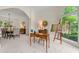 Bright and airy living room featuring large windows and an adjacent dining area for seamless entertaining at 542 Fairway Dr, Woodstock, GA 30189