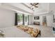 Spacious main bedroom features plush carpeting and lots of natural light at 542 Fairway Dr, Woodstock, GA 30189