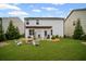 Beautiful backyard featuring a cozy fire pit, pergola, and lush green lawn at 149 Archie Way, Woodstock, GA 30188