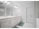 Bathroom featuring double sinks, lots of cabinet space, with large mirror at 149 Archie Way, Woodstock, GA 30188
