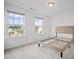 Sunlit bedroom featuring two windows overlooking the neighborhood at 149 Archie Way, Woodstock, GA 30188