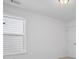 Bright bedroom with white walls and natural light streaming through the window at 149 Archie Way, Woodstock, GA 30188