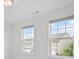 Bright bedroom with two windows and neutral walls at 149 Archie Way, Woodstock, GA 30188