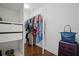 Walk-in closet with clothing racks, drawers, and space for luggage and accessories at 149 Archie Way, Woodstock, GA 30188