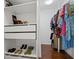Walk-in closet featuring built-in shelving, clothing racks, and space for shoes at 149 Archie Way, Woodstock, GA 30188