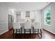 Open kitchen with stainless steel appliances and seating at 149 Archie Way, Woodstock, GA 30188