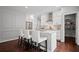 Bright kitchen with stainless steel appliances, white cabinets, and a pantry at 149 Archie Way, Woodstock, GA 30188
