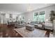 Bright living space seamlessly connects to a modern kitchen at 149 Archie Way, Woodstock, GA 30188