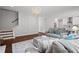 Open-concept living area with hardwood floors and natural light at 149 Archie Way, Woodstock, GA 30188