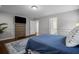 Bedroom showcasing neutral colors, hardwood floors, and natural light at 149 Archie Way, Woodstock, GA 30188
