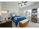 Comfortable bedroom with neutral tones, ceiling fan, and abundant natural light at 2063 Wheaton Way, Sandy Springs, GA 30328