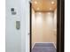 Modern residential elevator with wood interior and built-in lighting at 2063 Wheaton Way, Sandy Springs, GA 30328