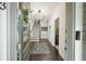 Inviting foyer with dark hardwood floors, a colorful rug, and an elegant chandelier at 2063 Wheaton Way, Sandy Springs, GA 30328