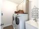 Well-organized laundry room with washer, dryer, sink, and ample storage space at 2063 Wheaton Way, Sandy Springs, GA 30328