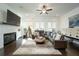Comfortable living room featuring a fireplace, plush seating, and stylish decor at 2063 Wheaton Way, Sandy Springs, GA 30328