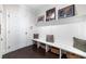 Mud room with bench seating, storage baskets, and decorative wall art at 2063 Wheaton Way, Sandy Springs, GA 30328