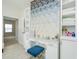Vanity area with marble countertop, blue accents, and geometric wallpaper at 2063 Wheaton Way, Sandy Springs, GA 30328