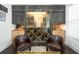 Custom wine cellar with a glass door, ample storage, and comfortable seating at 2063 Wheaton Way, Sandy Springs, GA 30328