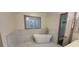 Bathroom featuring a standalone tub, elegant tile work, and natural light at 3261 Stonecreek Ct, Suwanee, GA 30024