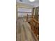 Hallway with wooden railing and view to a lower level at 3261 Stonecreek Ct, Suwanee, GA 30024