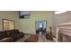 Open-concept living room featuring tall ceilings, a fireplace, and gray vinyl flooring at 3261 Stonecreek Ct, Suwanee, GA 30024