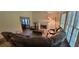 Spacious living room featuring tall ceilings, a fireplace, and views of the dining room at 3261 Stonecreek Ct, Suwanee, GA 30024