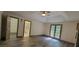 Main bedroom with vaulted ceiling, double doors to outside, and doorways to the bathroom and closet at 3261 Stonecreek Ct, Suwanee, GA 30024