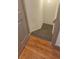 Interior view of a carpeted staircase leading down from a hardwood floor at 3261 Stonecreek Ct, Suwanee, GA 30024