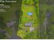 Aerial view of a 1-acre property featuring a home, in-ground pool, and mature trees at 1789 Brandi Ln, Loganville, GA 30052
