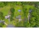 Aerial view of home with pool, outbuilding, and wooded perimeter at 1789 Brandi Ln, Loganville, GA 30052