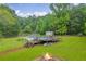Large backyard features an above ground pool with wooden deck, a fire pit, and a storage shed at 1789 Brandi Ln, Loganville, GA 30052