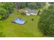 Aerial view of large backyard with above ground pool, fire pit, and a charming single-Gathering home at 1789 Brandi Ln, Loganville, GA 30052